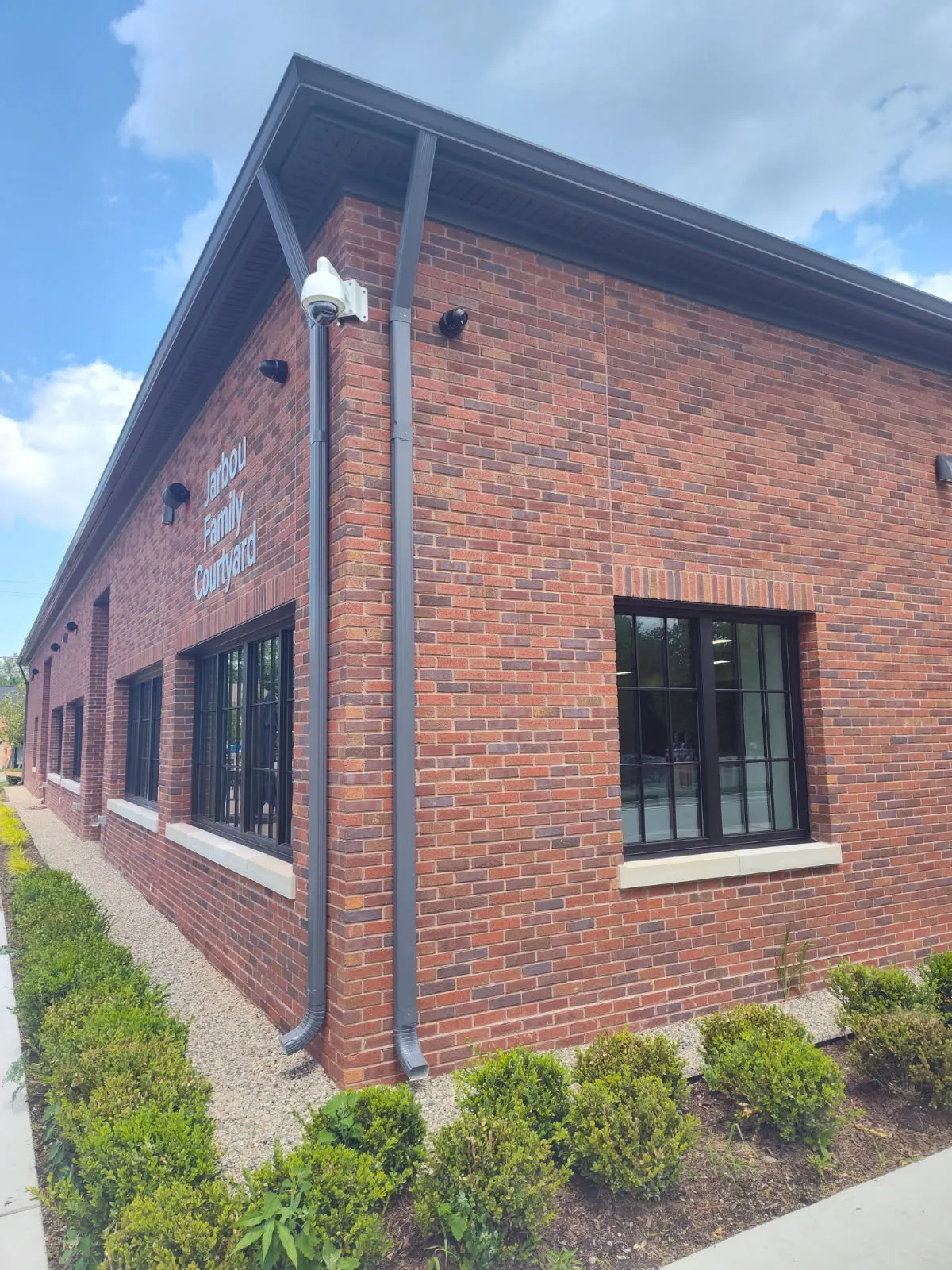 Completed commercial building exterior with new roof by DG Builders in Lapeer County Michigan