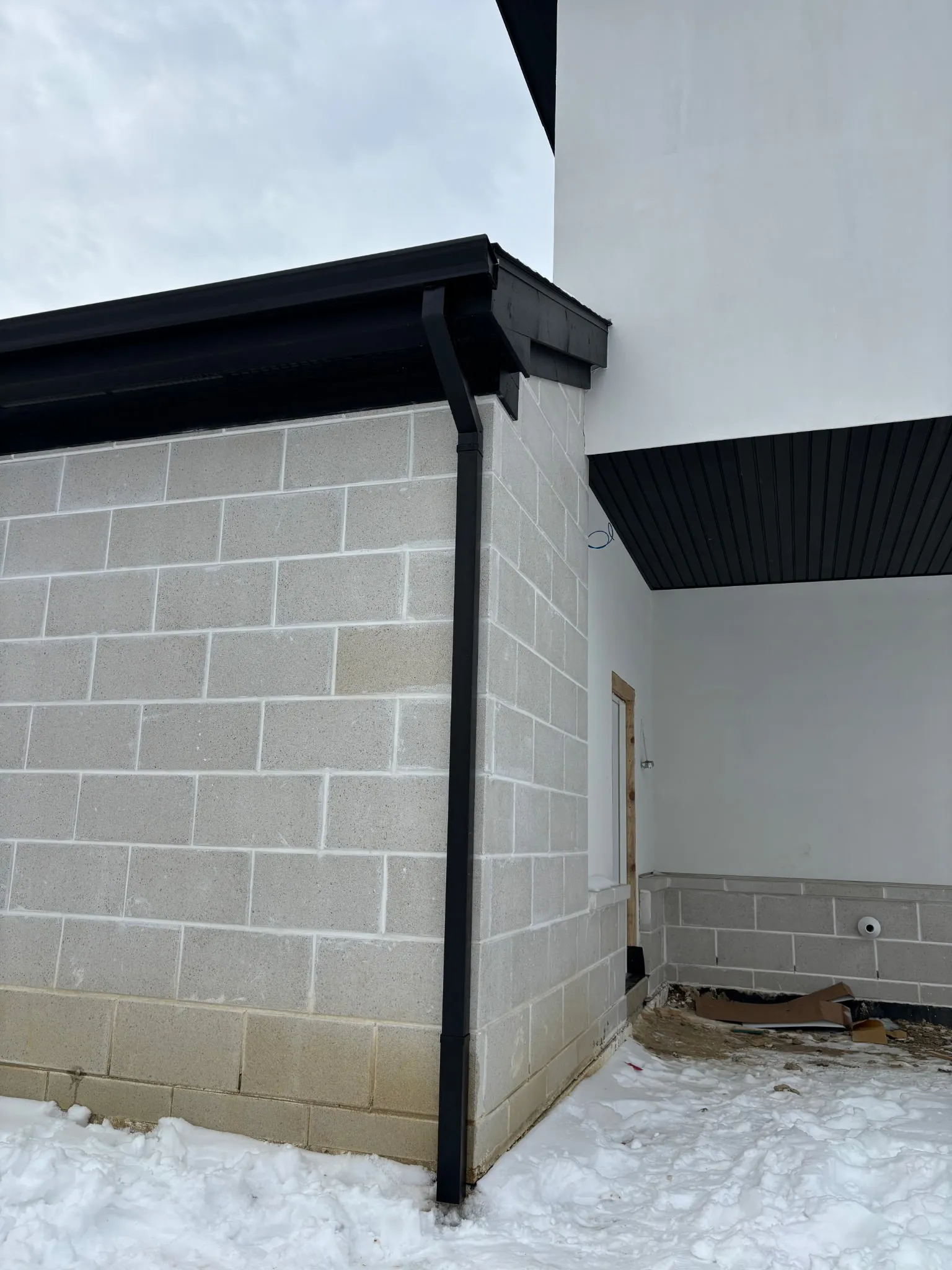 Gutter downspout installation by DG Builders LLC in Lapeer County Michigan