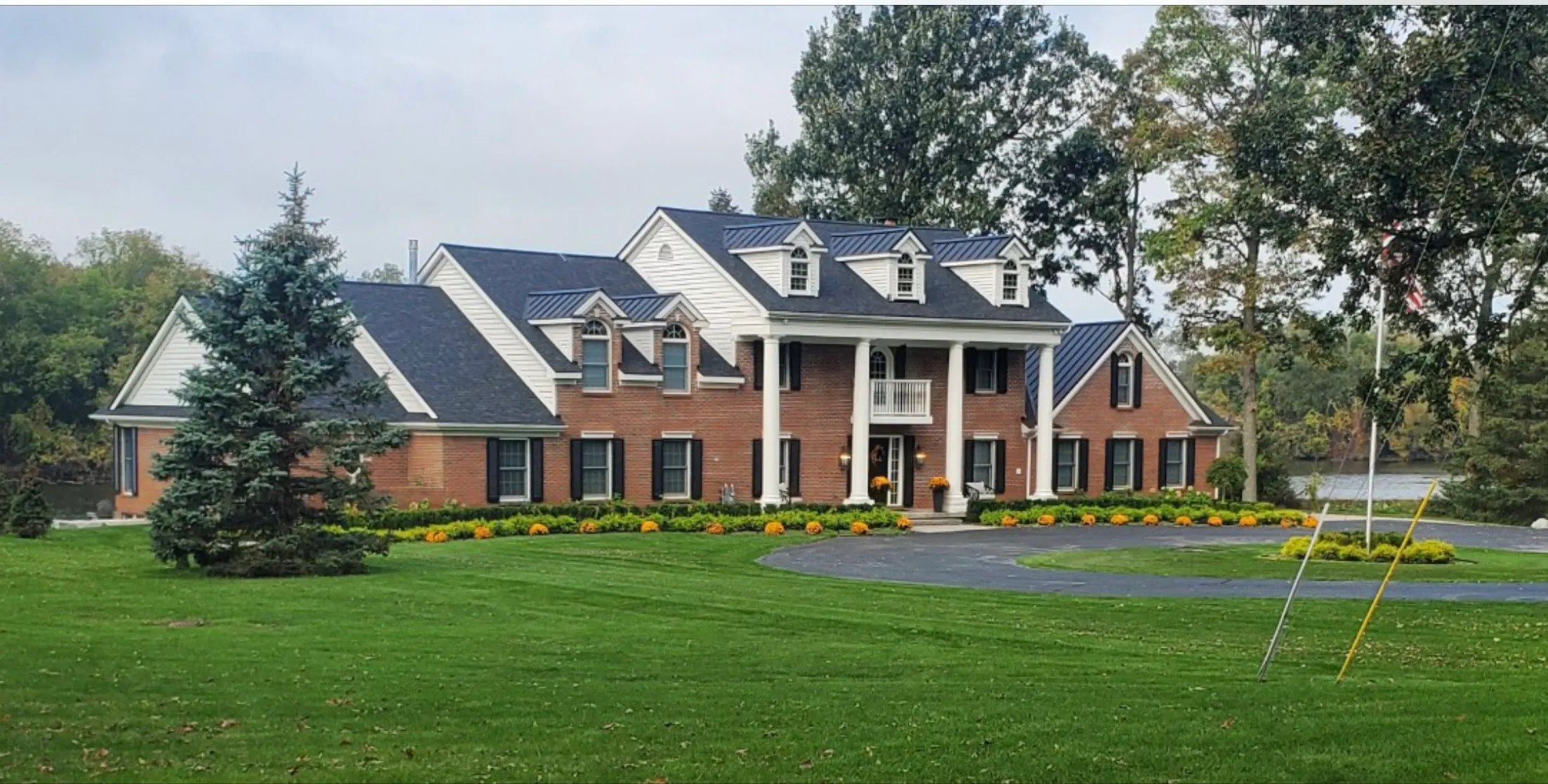 Beautiful residential home with new roof installed by DG Builders LLC in Oakland County Michigan