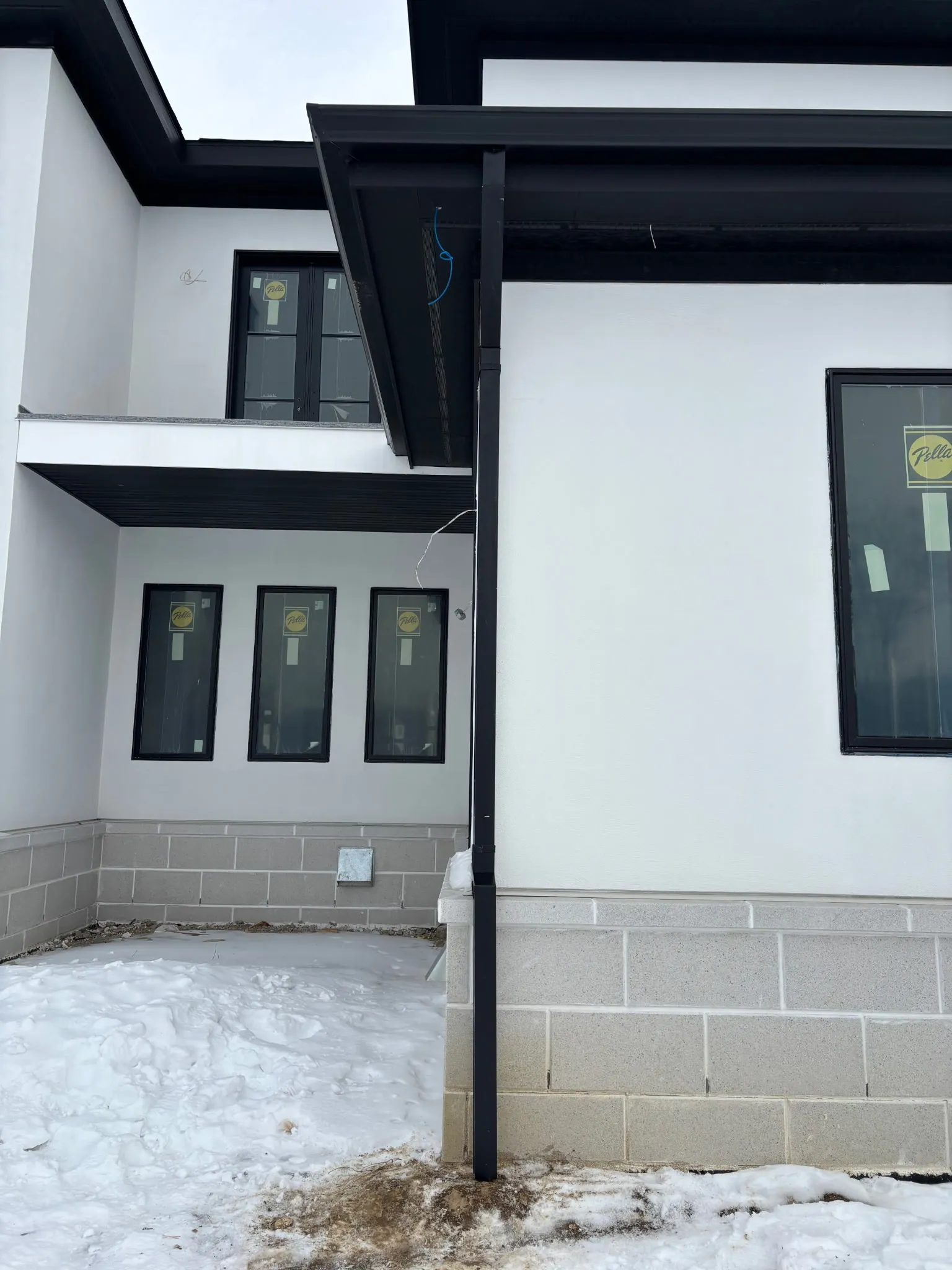 Seamless gutter corner detail on modern building by DG Builders LLC in Genesee County Michigan